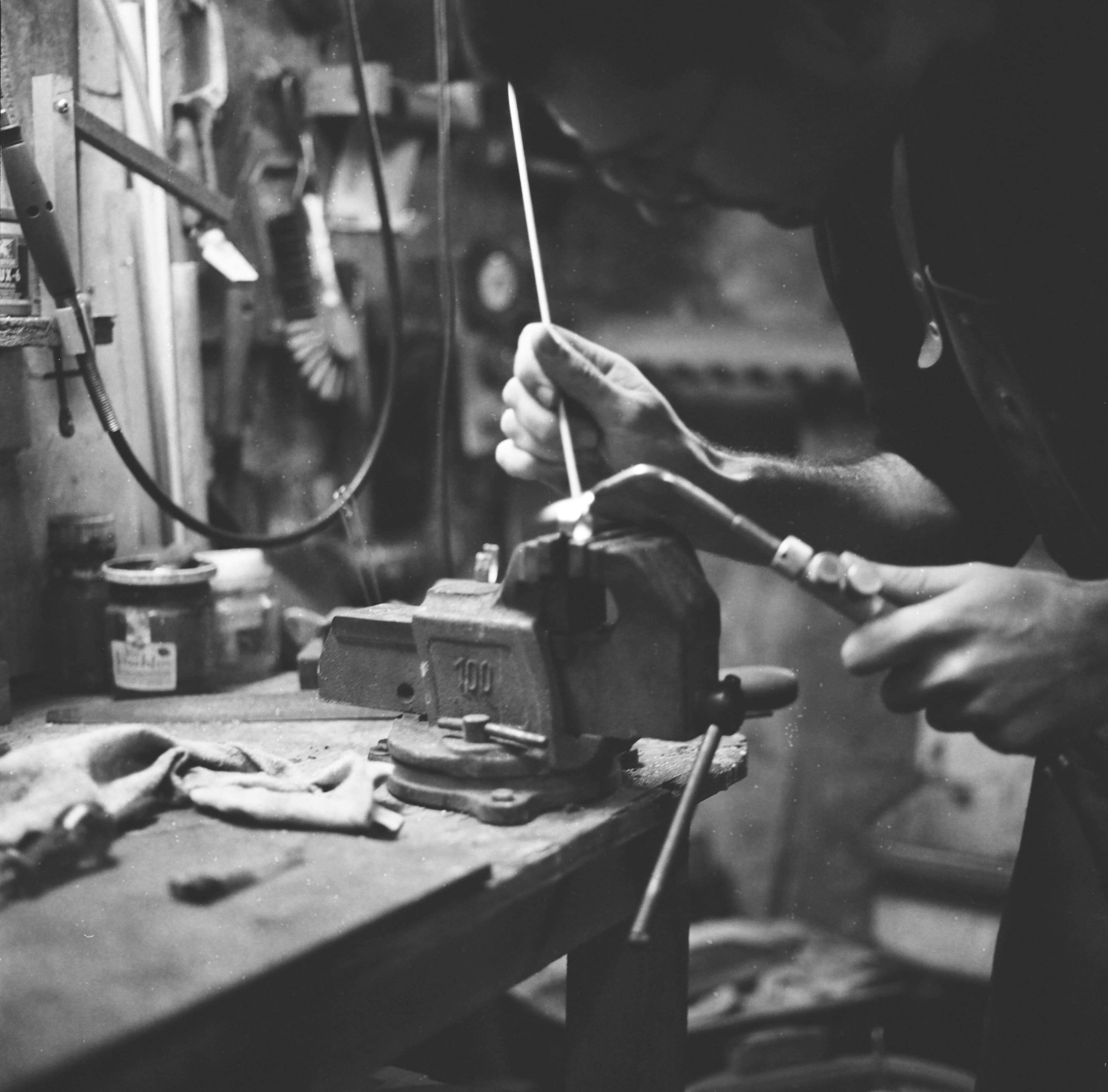 Filing a piece held in the workbench vice